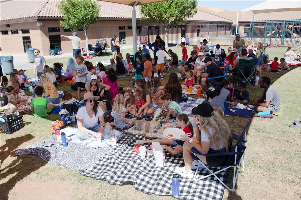 Families visit students during lunch and play games.